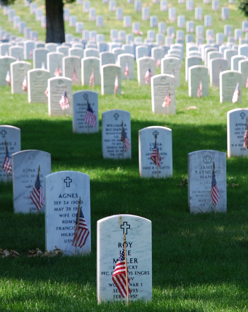 Picture of graves decorated with flags at Arlington National Cemetery on Memorial Day 